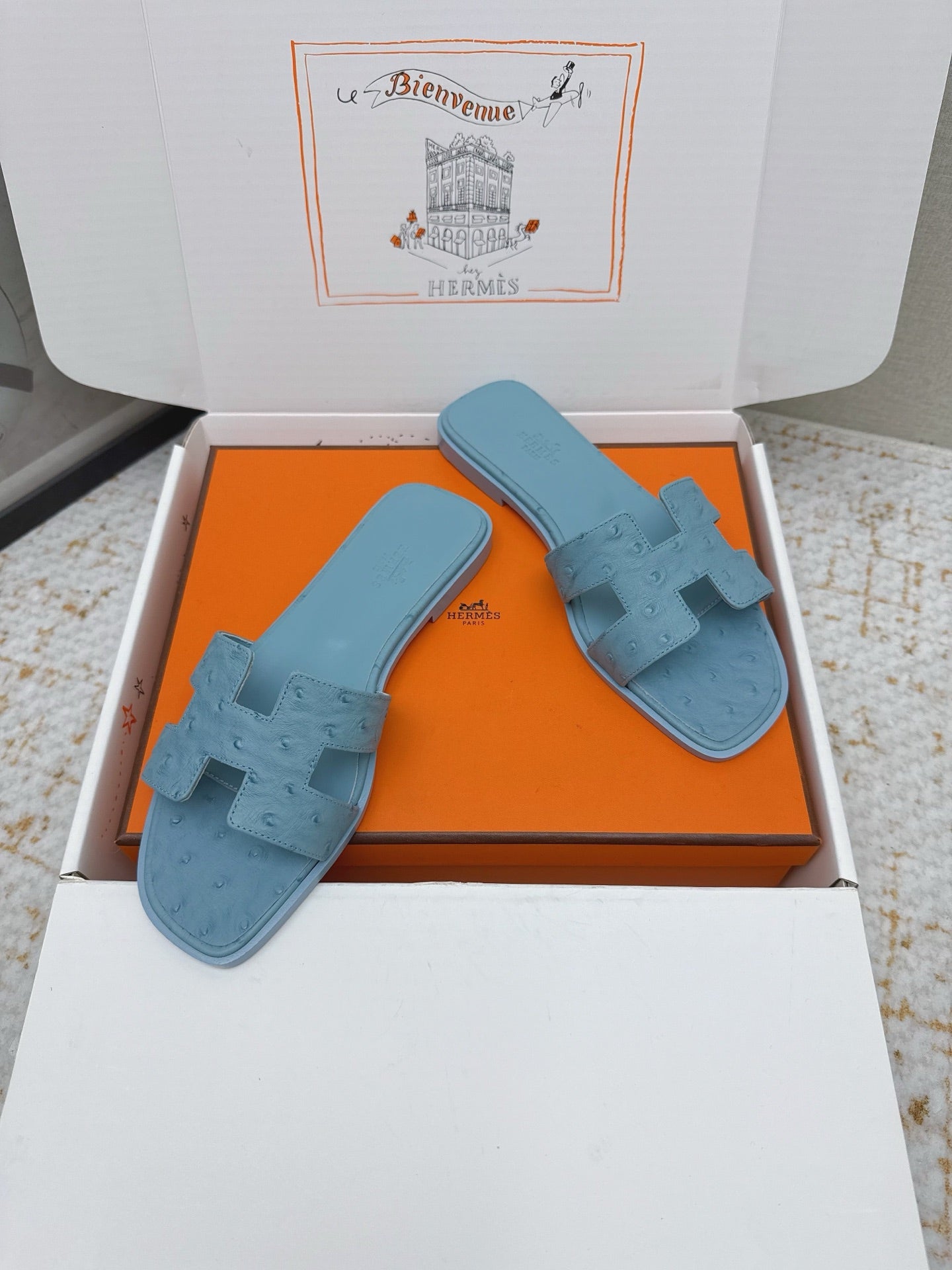 HM 26ss Oran Sandals Light Blue Ostrich Leather 625103