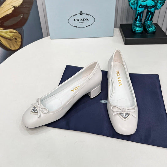 Prada 26s Round Toe Pumps Block Heel 40mm In White Calfskin With Bow